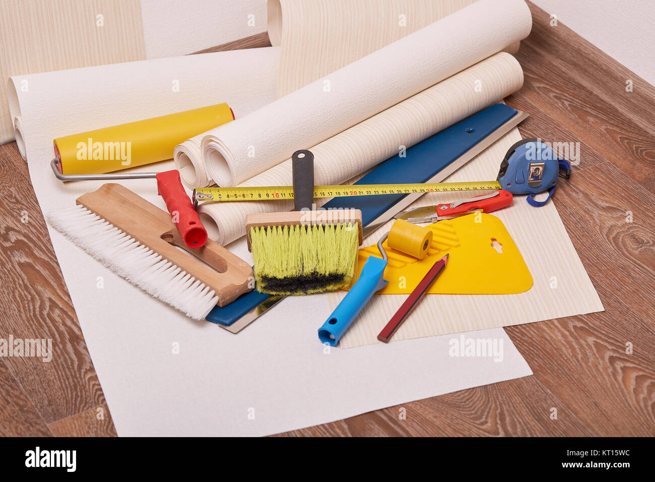 Rolls of wallpapers and various tools for wallpapering Stock Photo Alamy