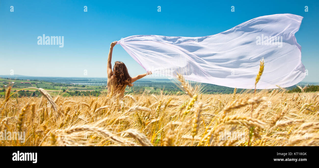 Young happy woman in wheat field with fabric. Summer set Stock Photo ...