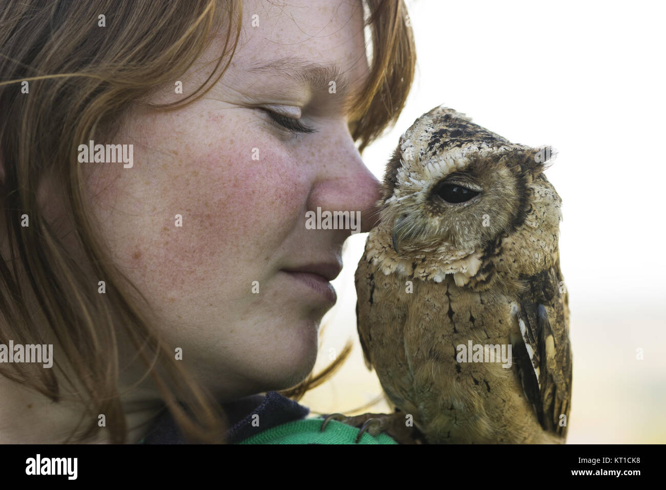 young woman with hindu collar owl on shoulder Stock Photo