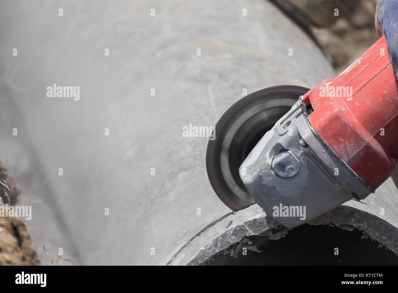 Plumbers cutting concrete water pipes Stock Photo Alamy