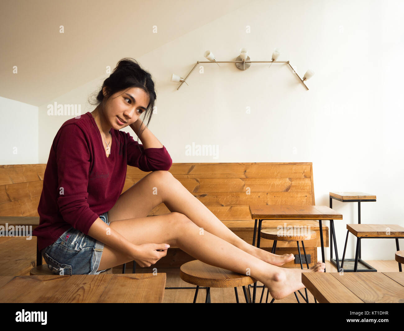 Asian woman sitting on the chair Stock Photo - Alamy