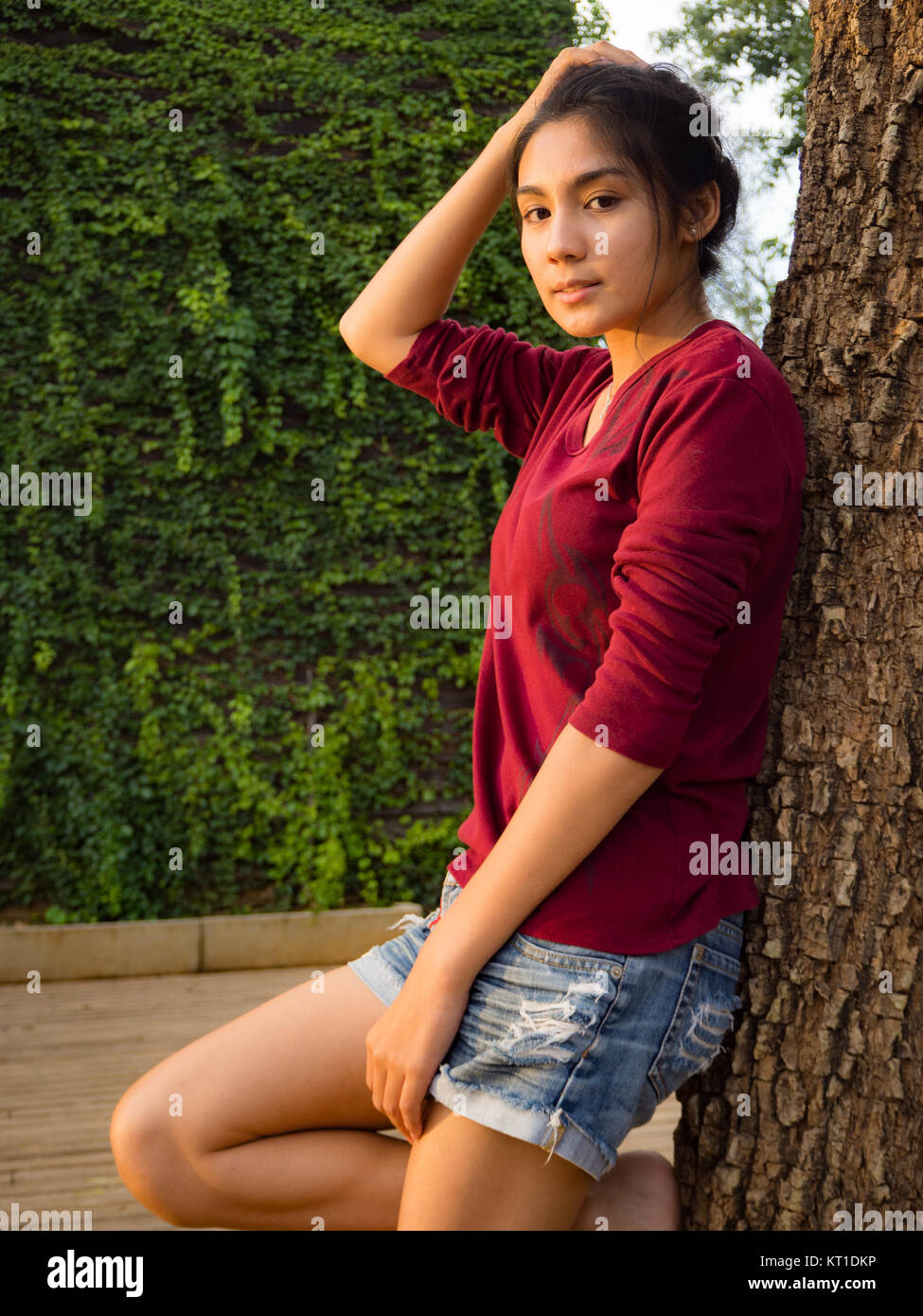 Asian woman standing on the wood plate Stock Photo