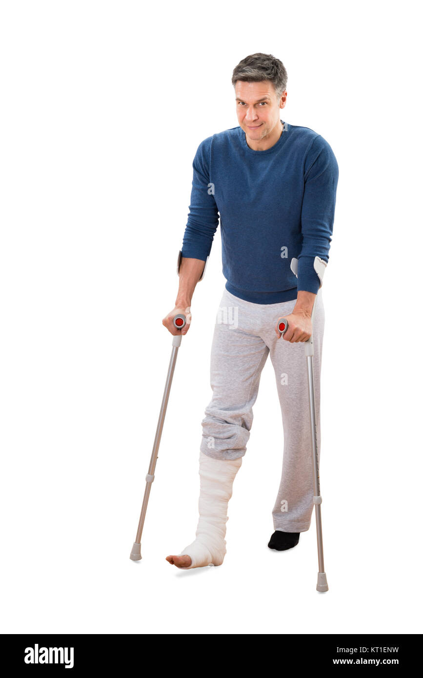 Disabled Man Using Crutches For Walking Stock Photo Alamy