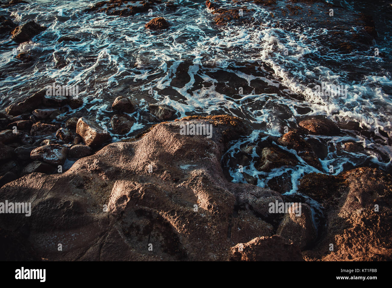View of ocean waves and fantastic rocky coast with beautiful shaped ...