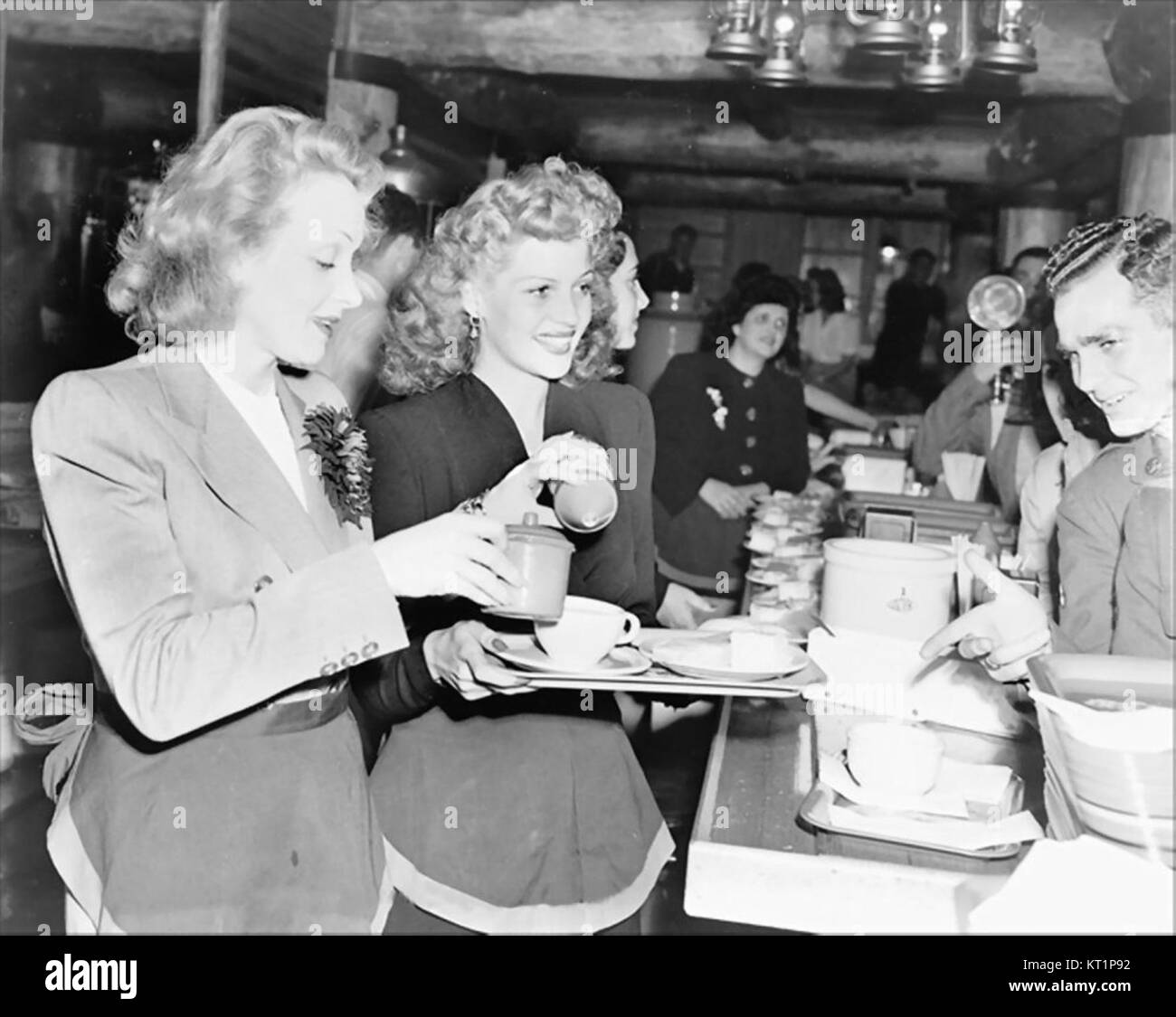The Hollywood Canteen, established in 1942, was a nightclub providing a recreational space for servicemen during World War II. Stars like Dietrich and Hayworth contributed to its cultural significance, offering performances and entertainment. Stock Photo