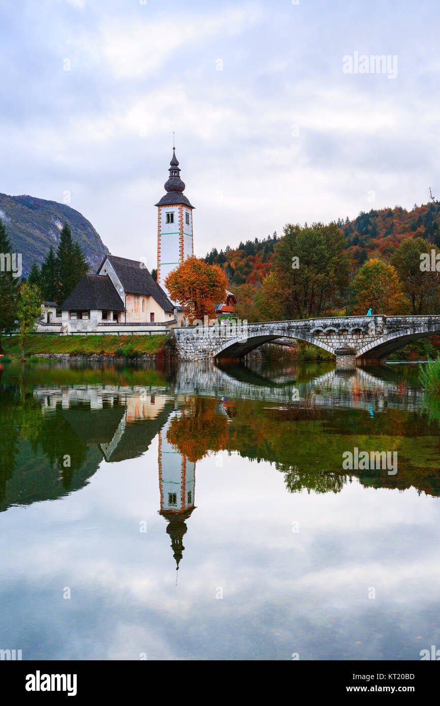 Church tower and stone bridge at Lake Bohinj Stock Photo Alamy
