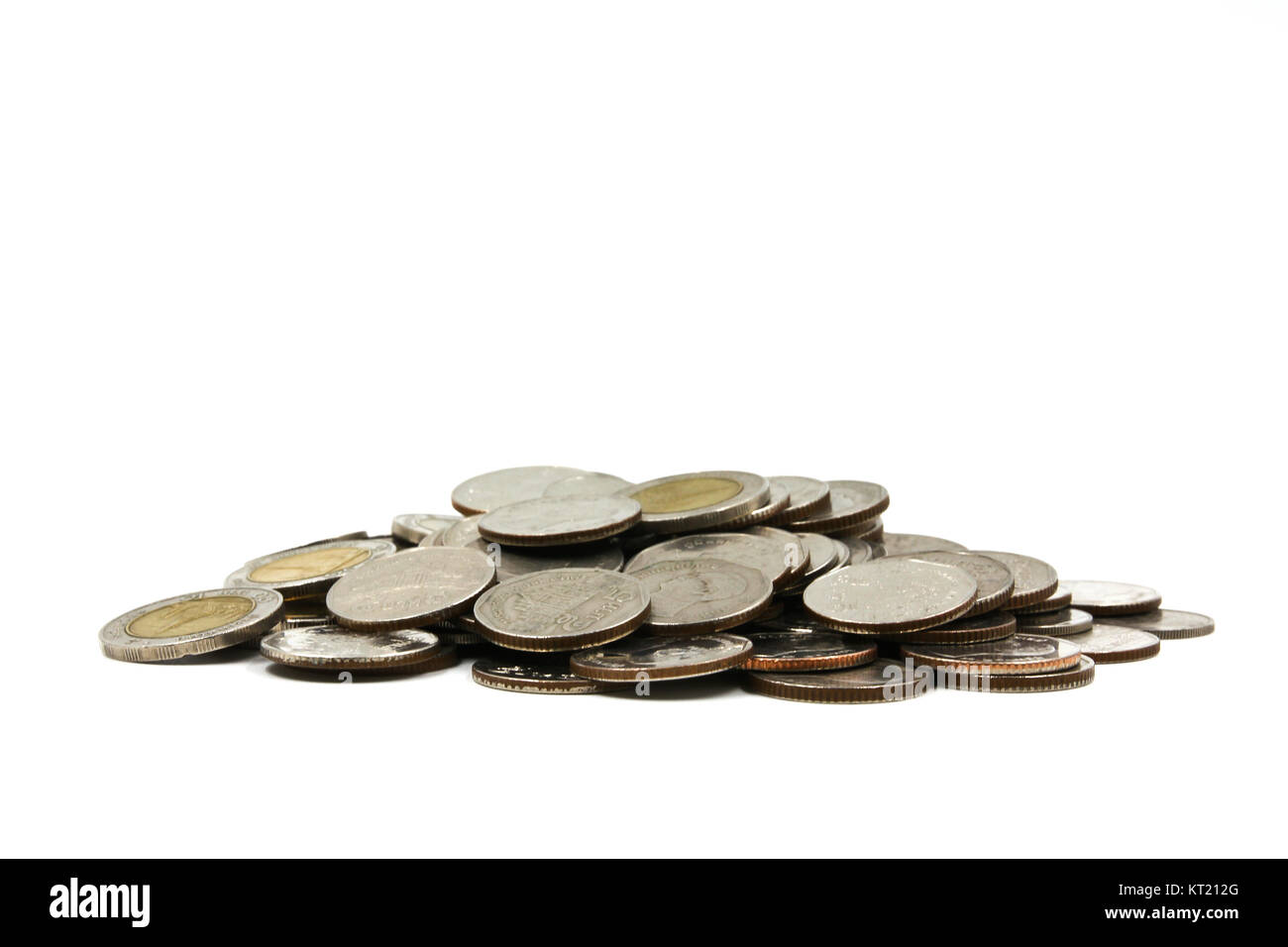 A pile of coins on white background Stock Photo