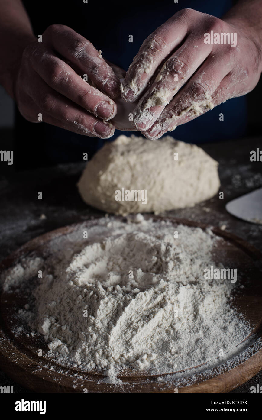 Baker kneading dough Stock Photo Alamy