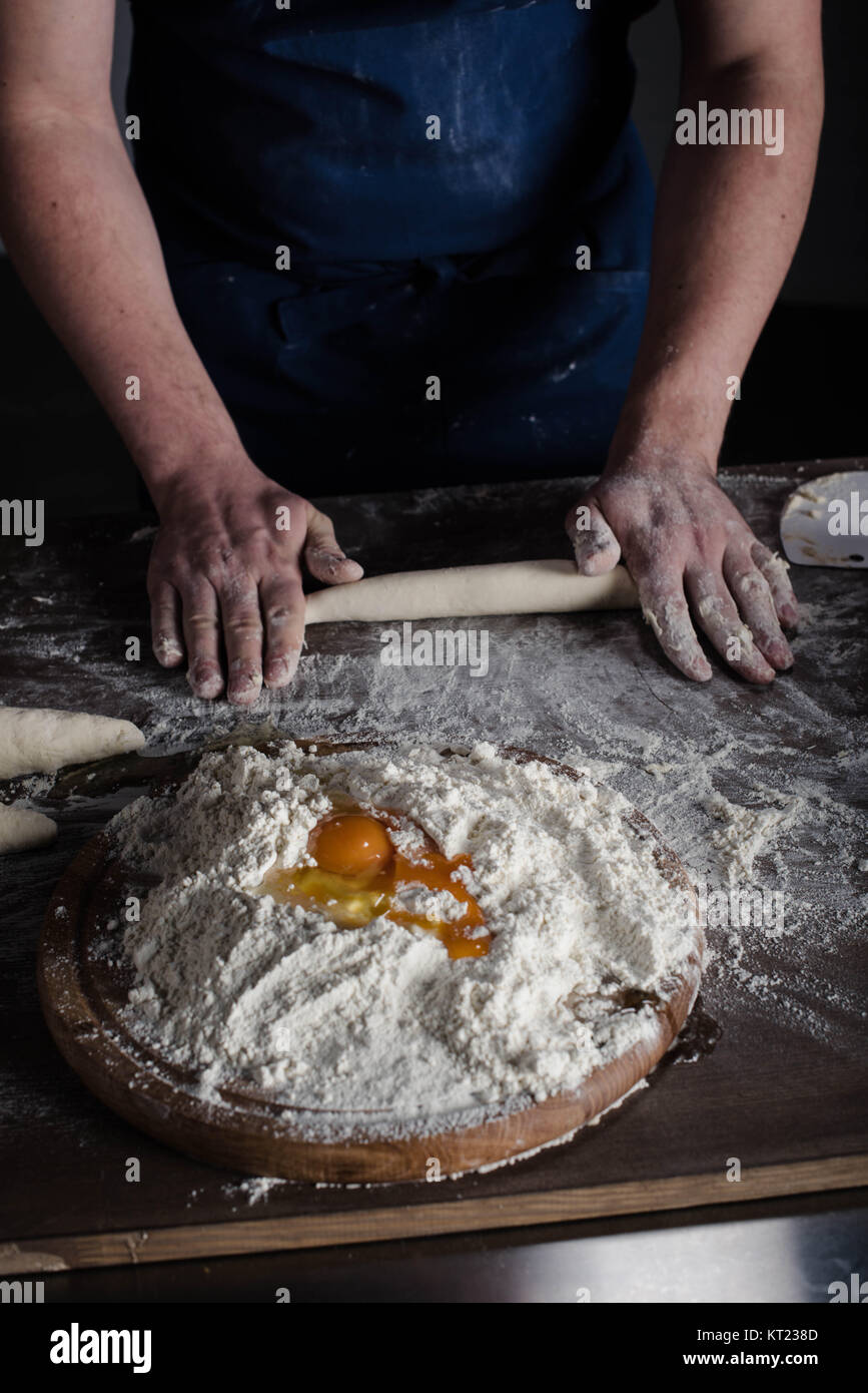 Baker kneading dough Stock Photo Alamy