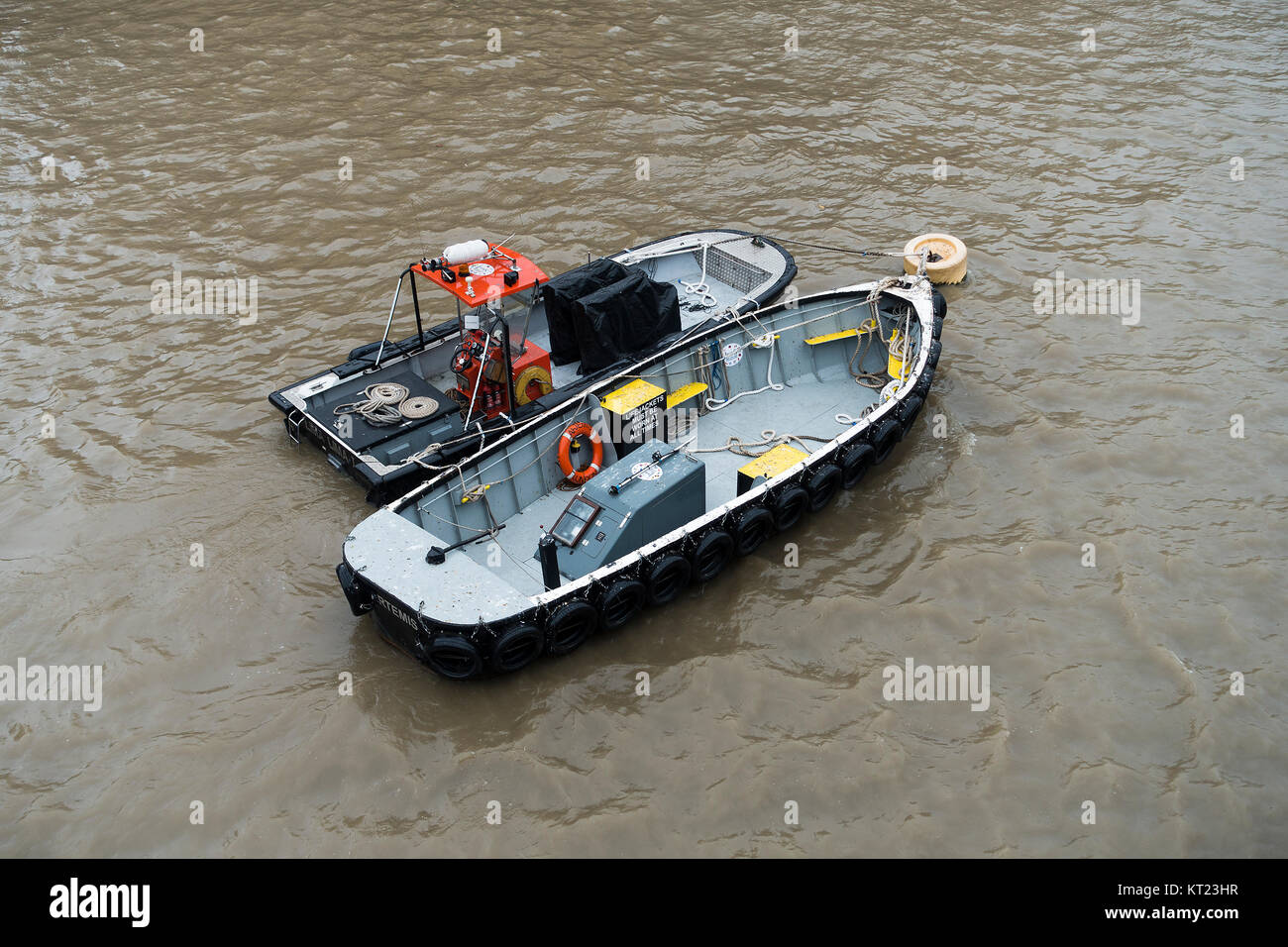Two Livetts Safety Boats Artemis and Lima Lima Moored in the River Thames near HMS Belfast London England United Kingdom UK Stock Photo