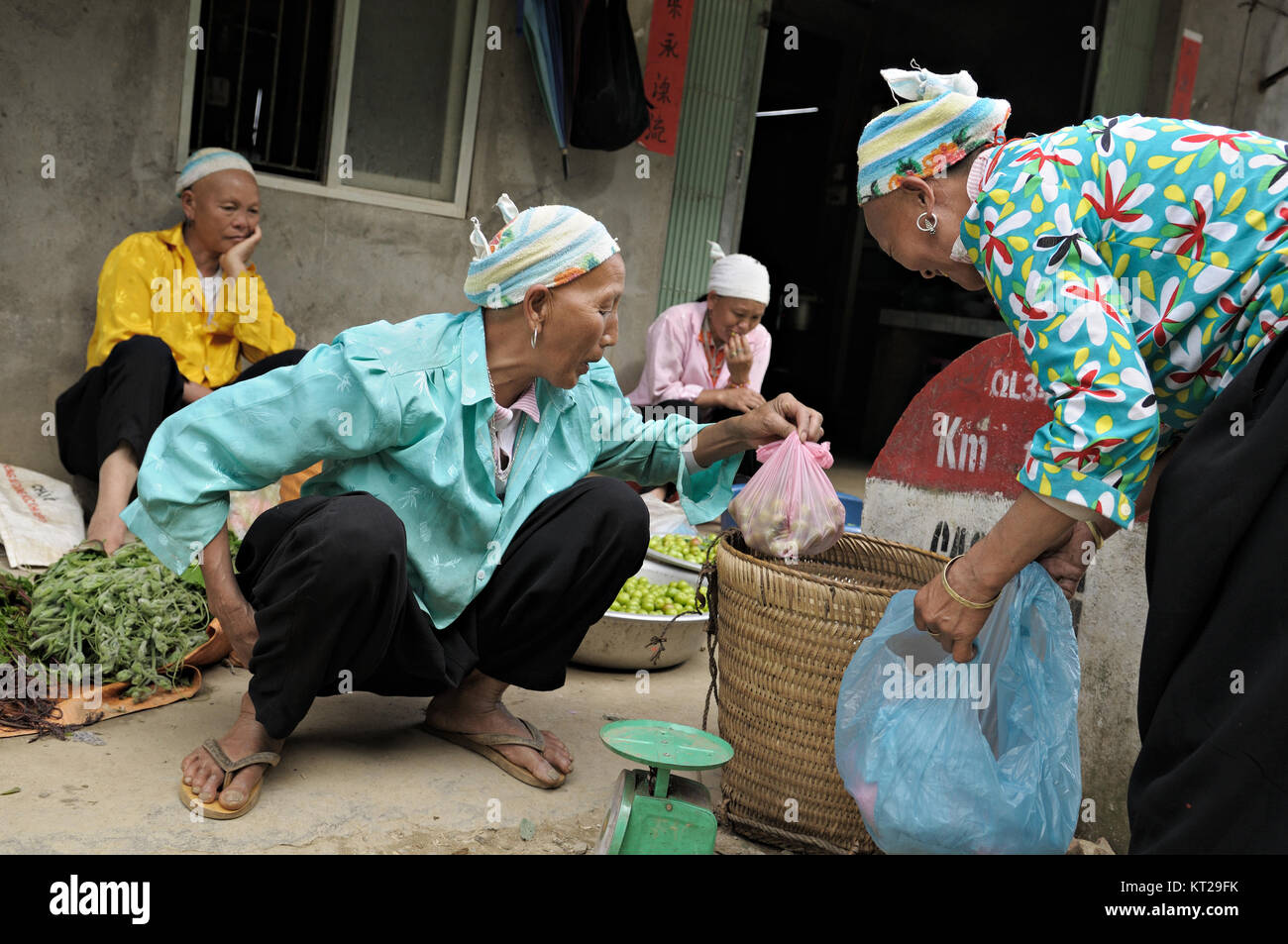 Four tribeswomen with shaved hair and eyebrows in the North of Vietnam Stock Photo