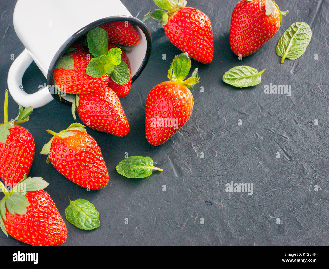 strawberries in wooden bowl Stock Photo - Alamy