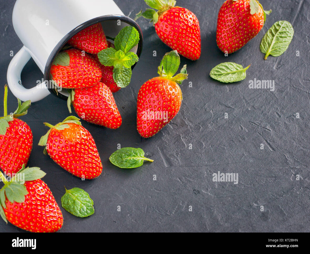 strawberries in wooden bowl Stock Photo - Alamy
