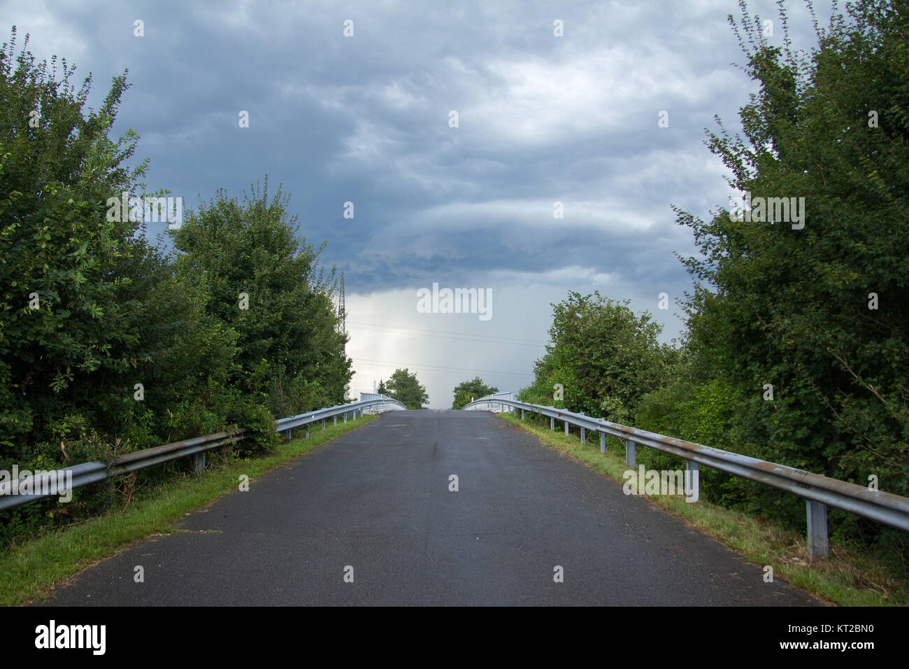 rising asphalt road after a rain shower in styria in summer Stock Photo