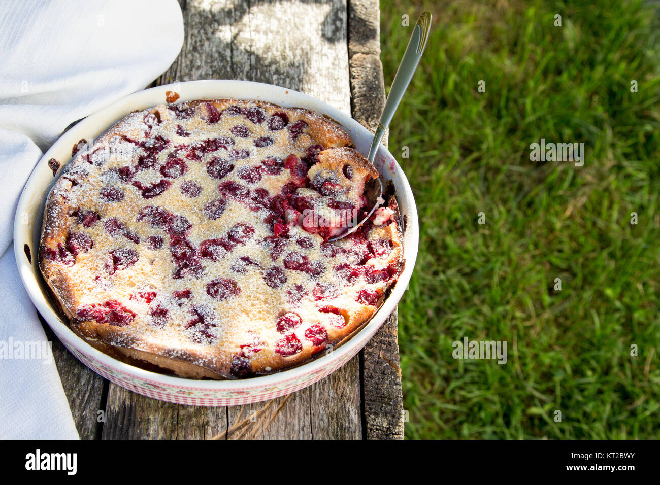 Cherry clafoutis. Homemade cherry pie on rustic background Stock Photo ...