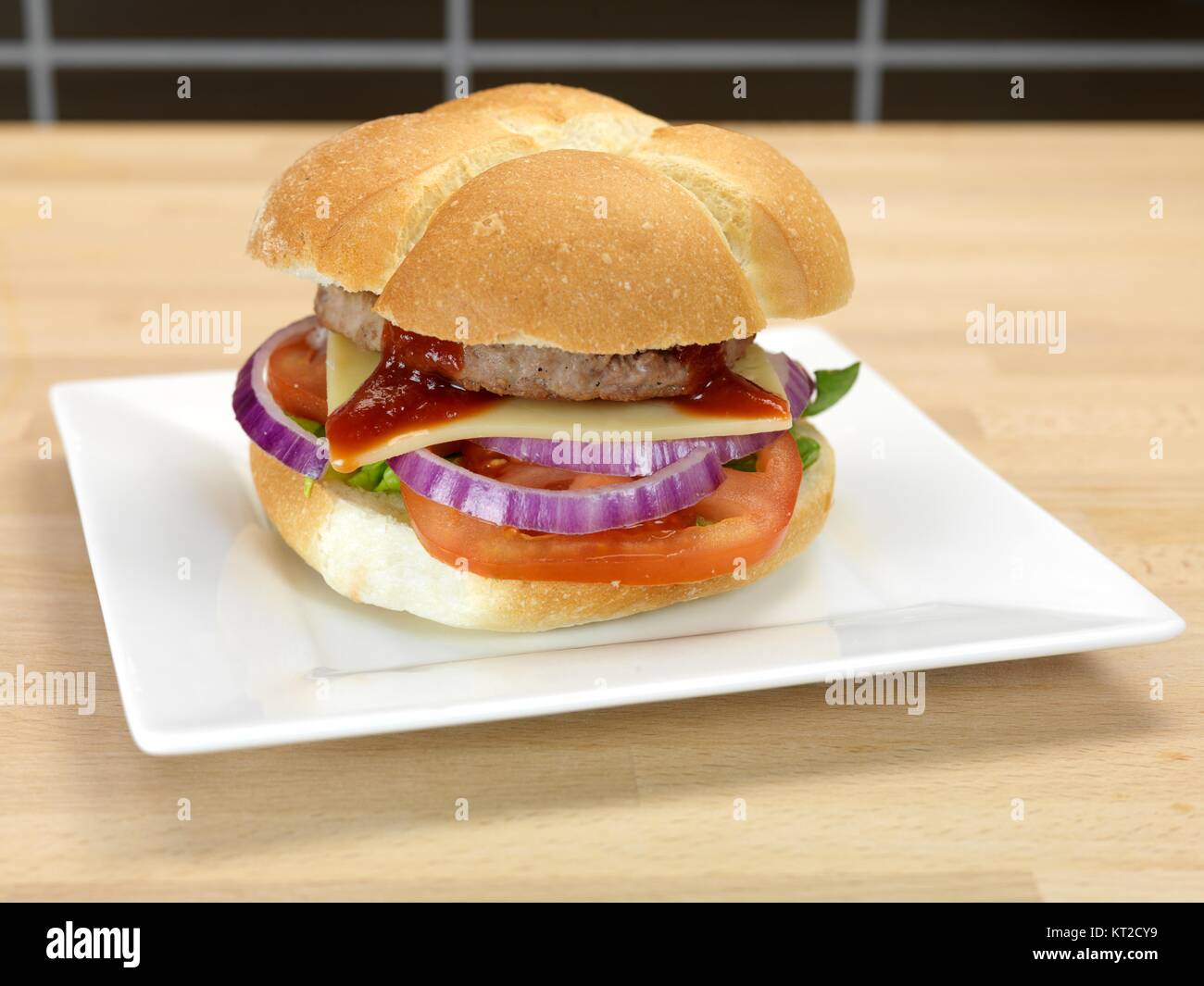A freshly made American style hamburger with sauce Stock Photo Alamy