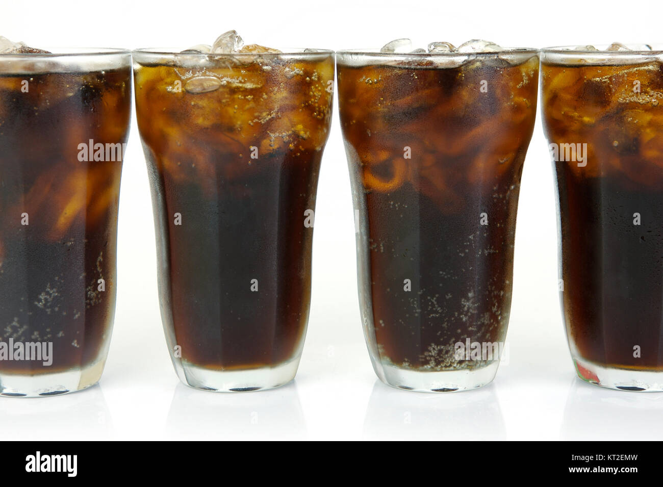Glasses of cola isolated against a white background Stock Photo - Alamy
