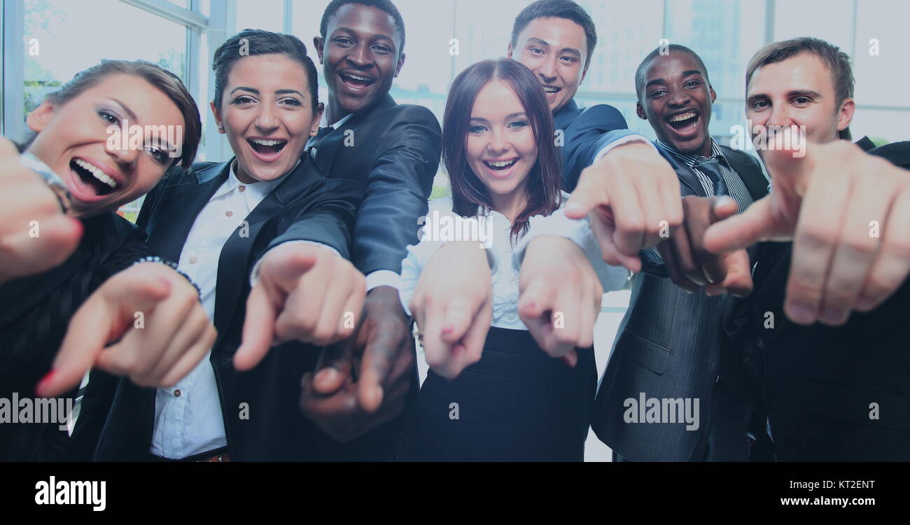 Happy multi-ethnic business team with thumbs up in the office Stock ...