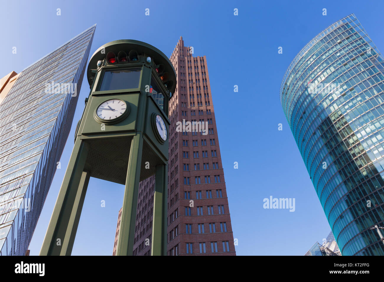 Berlin - The clock on and the high buildings of Posdam square. Stock Photo