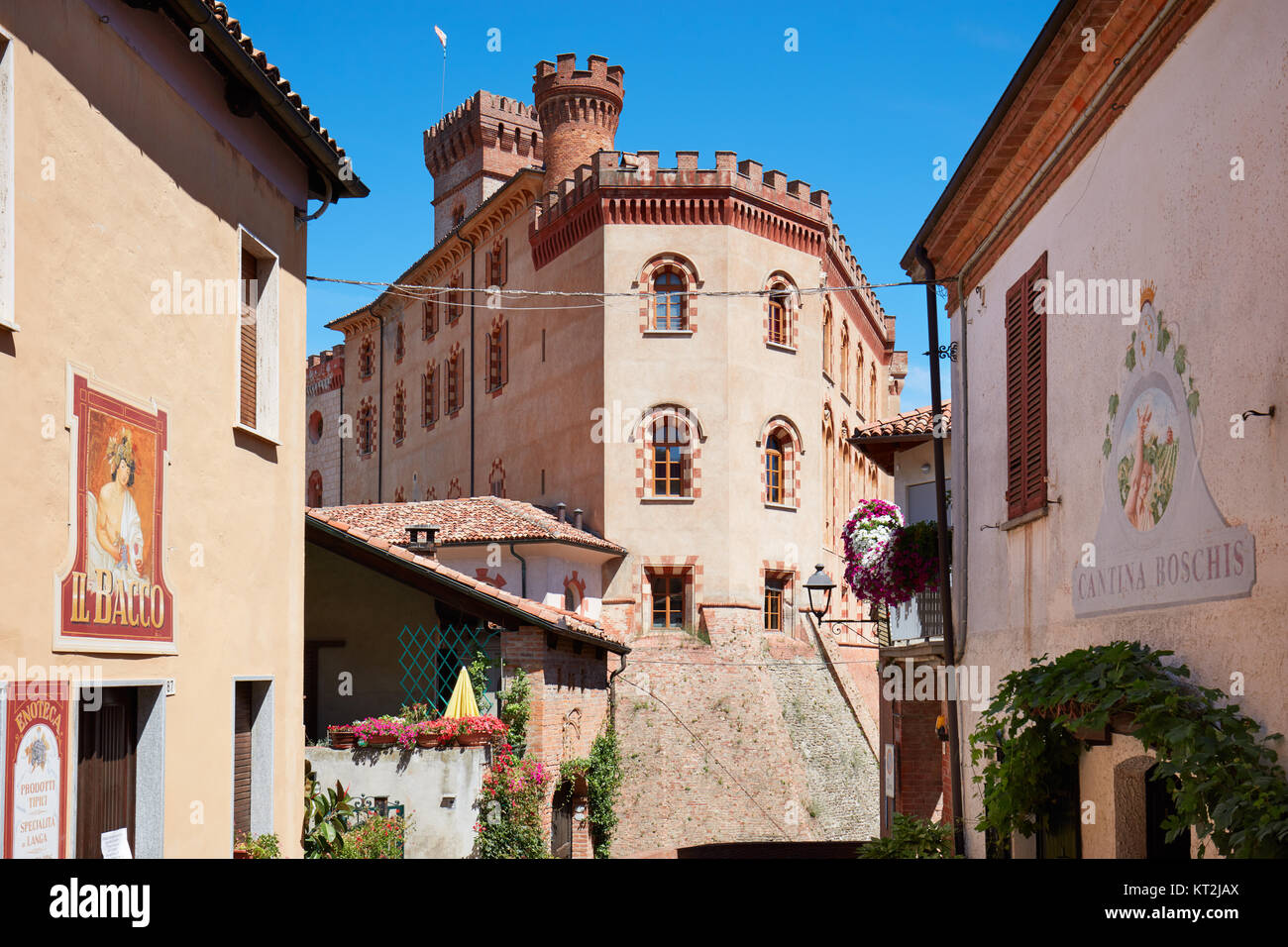 Barolo medieval castle and Bacco wine shop sign in a sunny summer day, blue sky in Barolo, Italy Stock Photo