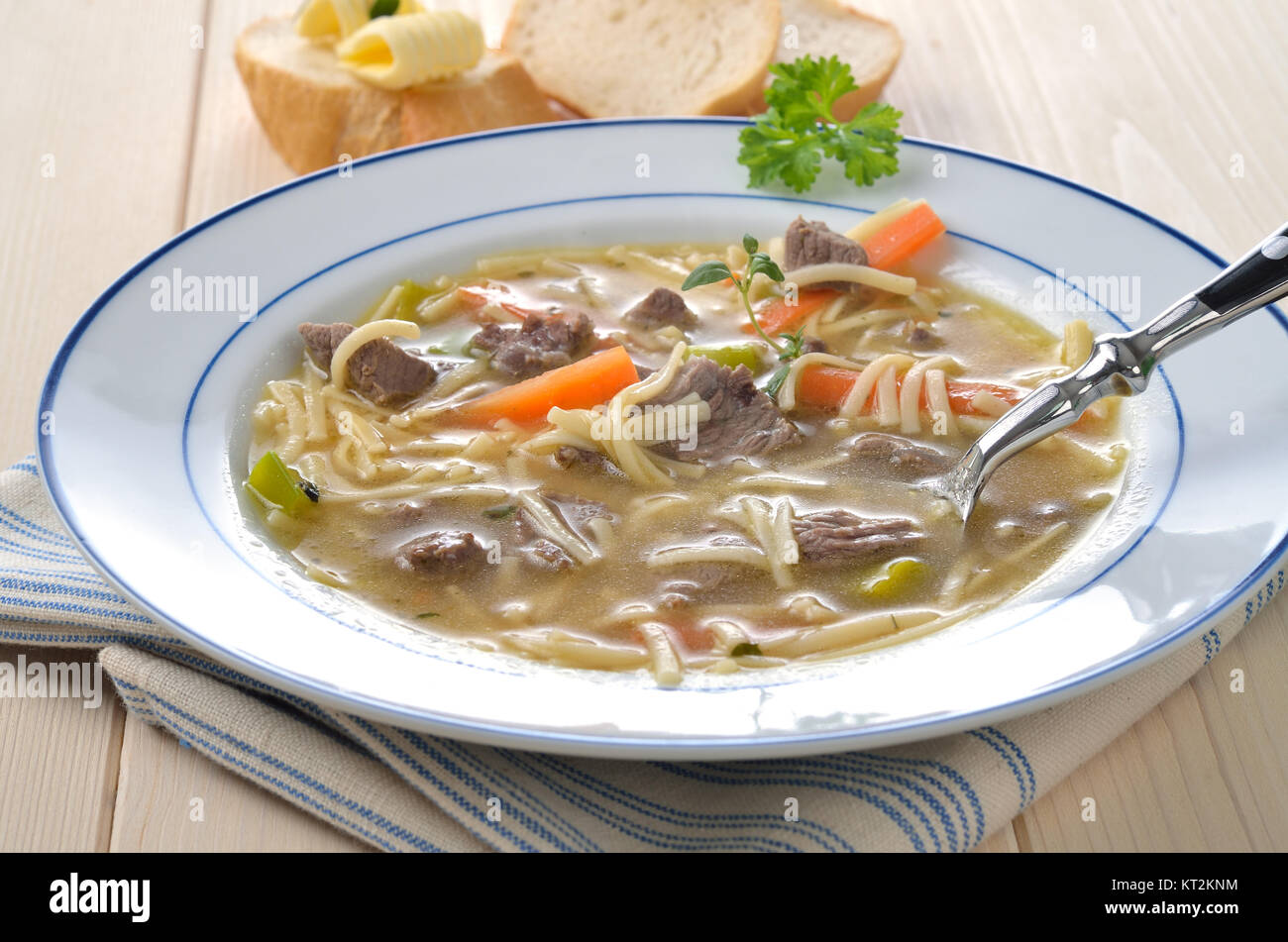 Beef bouillon with noodles and pieces of meat Stock Photo Alamy