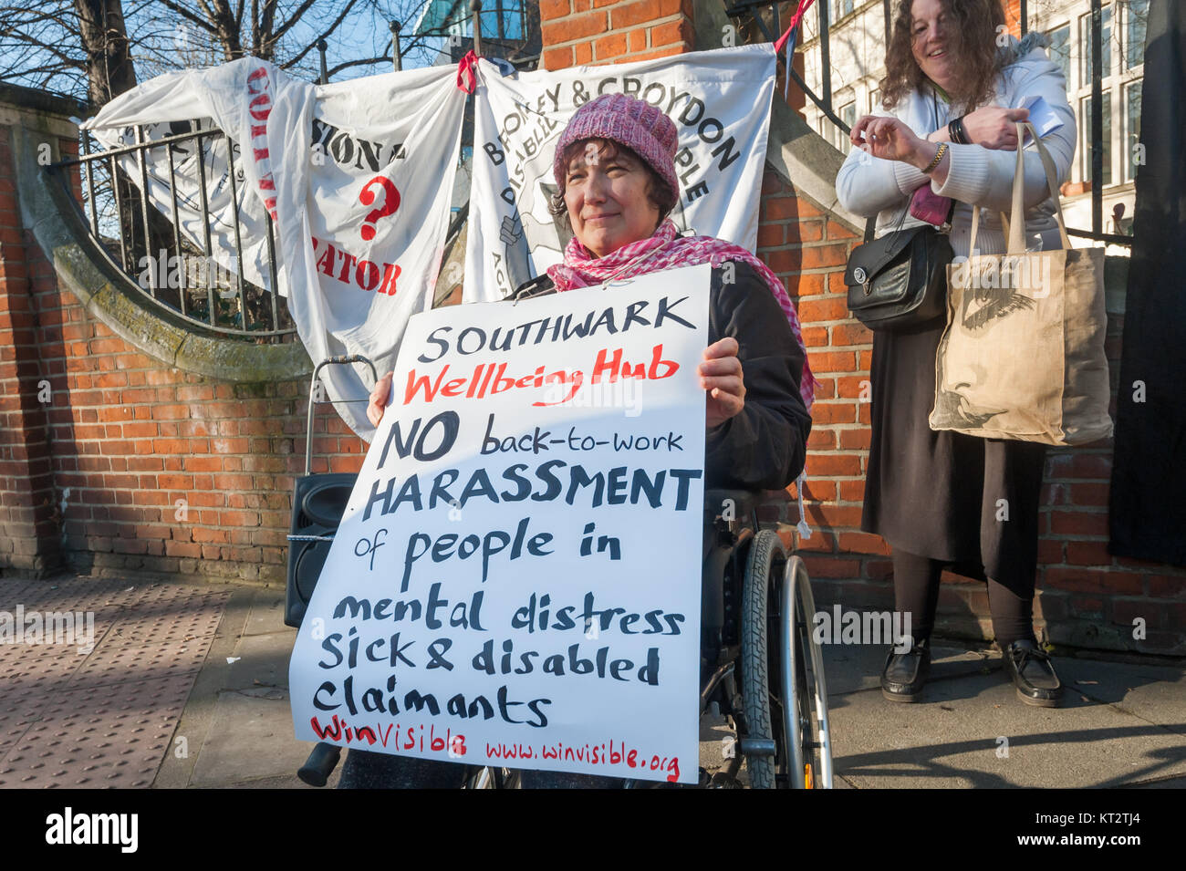 Claire Glasman of Winvisible (women with visible and invisible disabilities) at the Mental Health Resistance Network protest the new Southwark 'hub' at Thames Reach Employment Academy which will run DWP forced back to work treatment to get mental health sufferers back to work Stock Photo