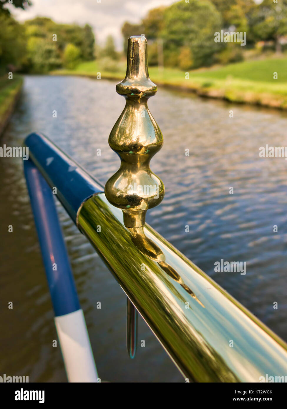 A polished brass tiller and tiller pin on a canal narrowboat Stock