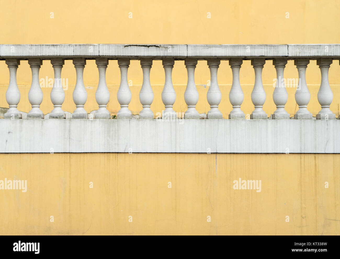 Yellow Cardboard Railing Yellow wall with white railing Stock Photo - Alamy