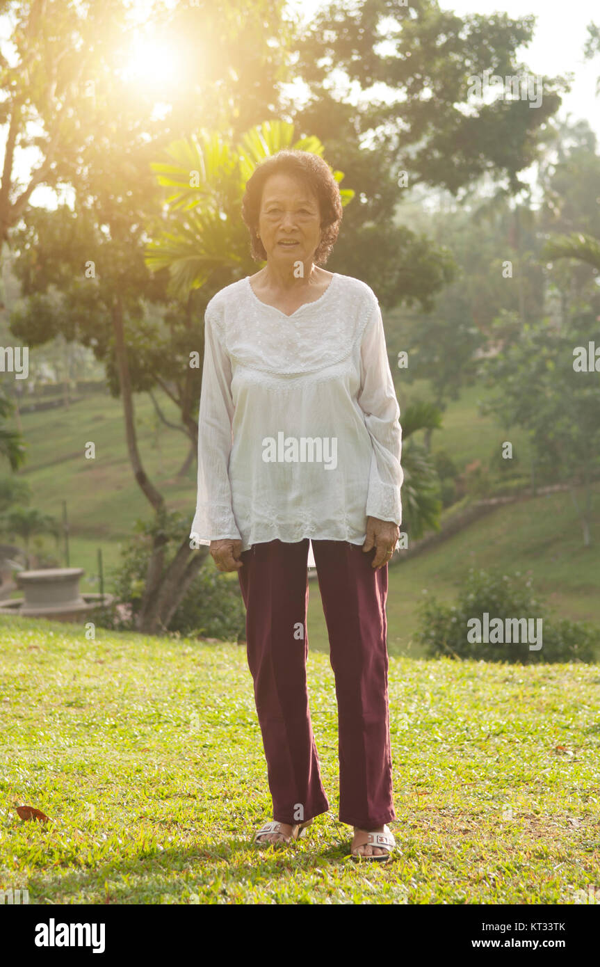 Asian seniors woman walking at outdoor Stock Photo - Alamy