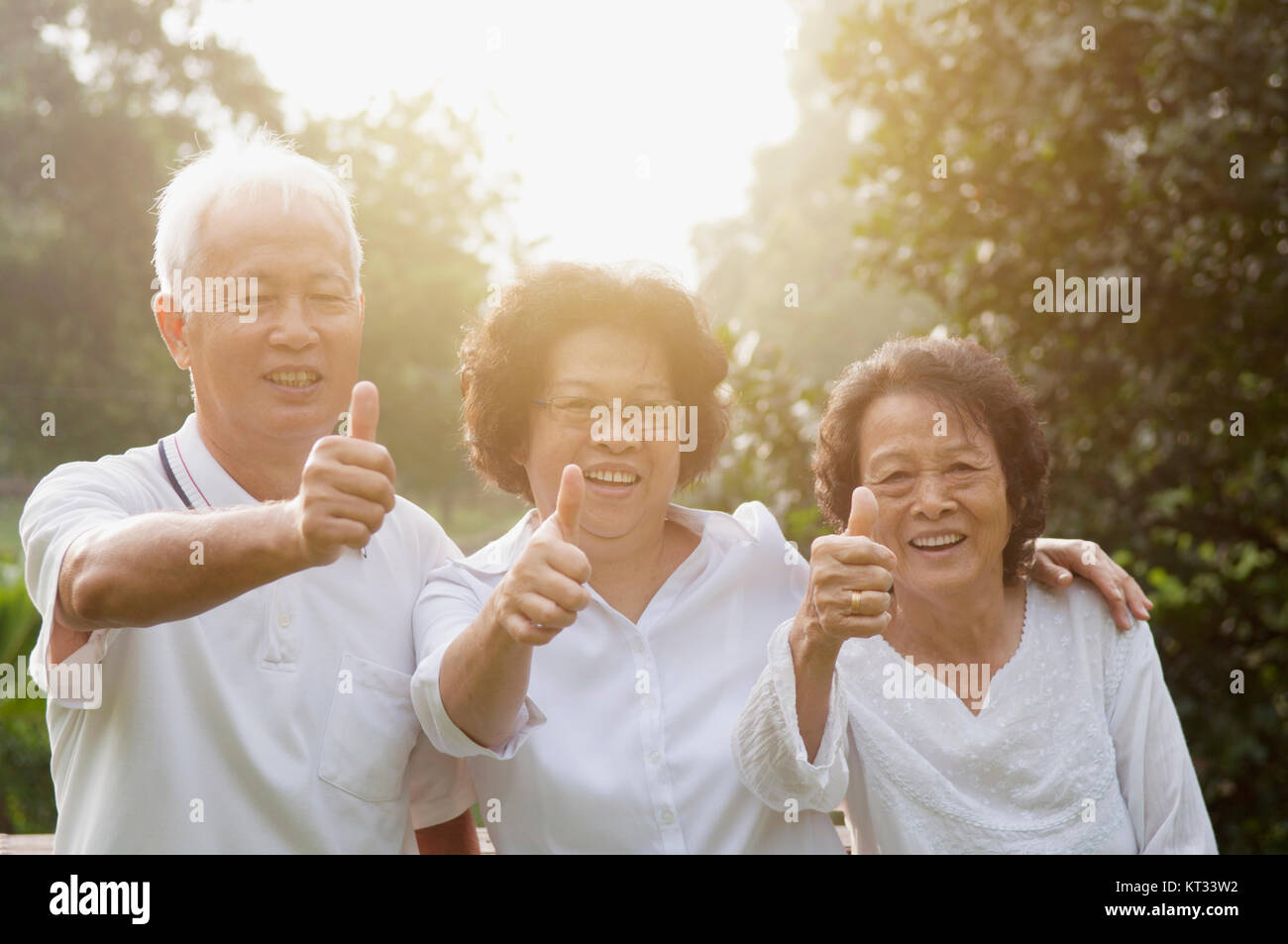 Woman smiles giving thumbs up hi-res stock photography and images - Alamy