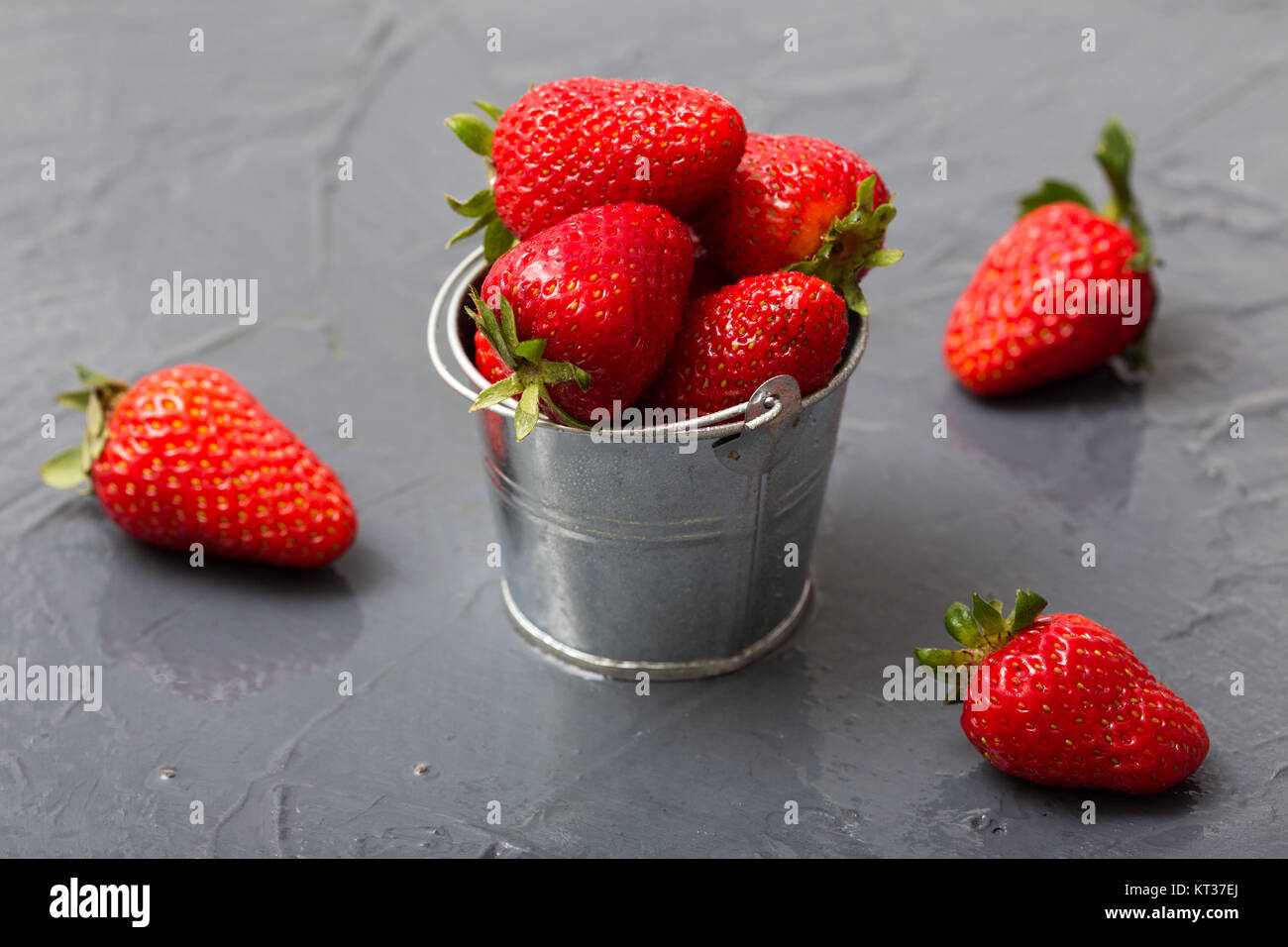 fresh organic strawberries in a small bucket Stock Photo - Alamy