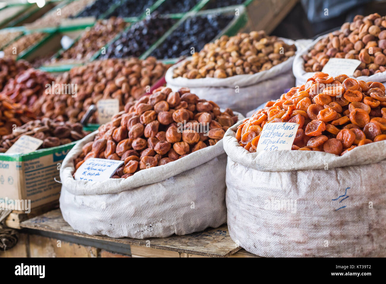 Dry fruits and spices like cashews, raisins, cloves, anise, etc. on display for sale in a Osh bazaar in Bishkek Kyrgyzstan. Stock Photo