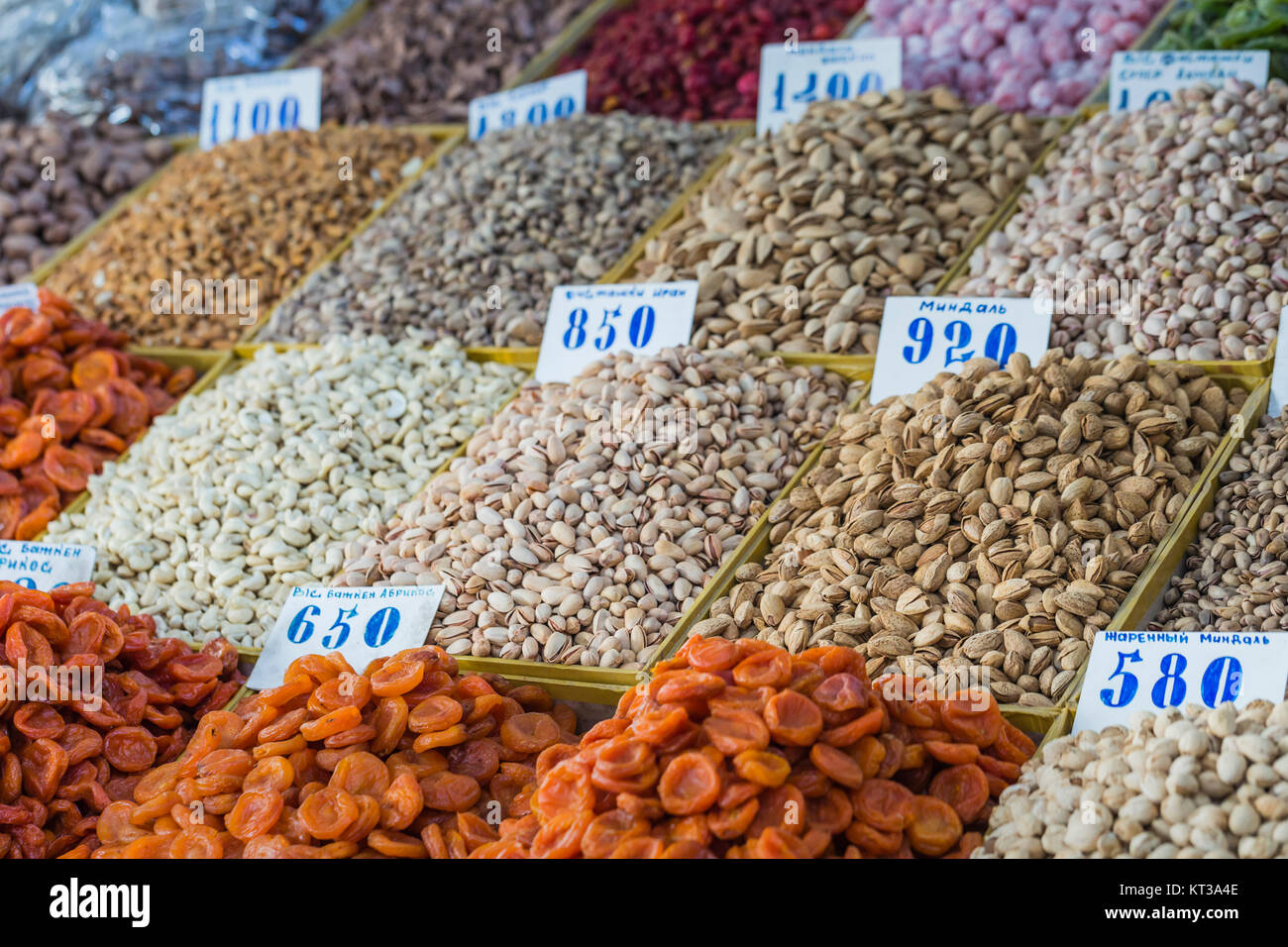 Dry fruits and spices like cashews, raisins, cloves, anise, etc. on display for sale in a Osh bazaar in Bishkek Kyrgyzstan. Stock Photo