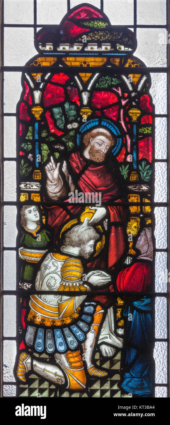 LONDON, GREAT BRITAIN - SEPTEMBER 19, 2017: Peter Baptizing the Centurion Cornelius on the stained glass in St Mary Abbot's church Stock Photo