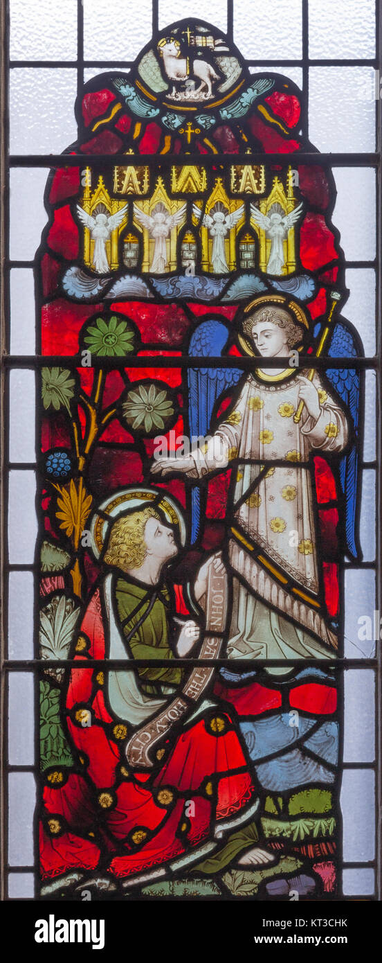 LONDON, GREAT BRITAIN - SEPTEMBER 19, 2017: The St. John the Evangelist at the vision of angels from Apokalipse on the stained glass Stock Photo