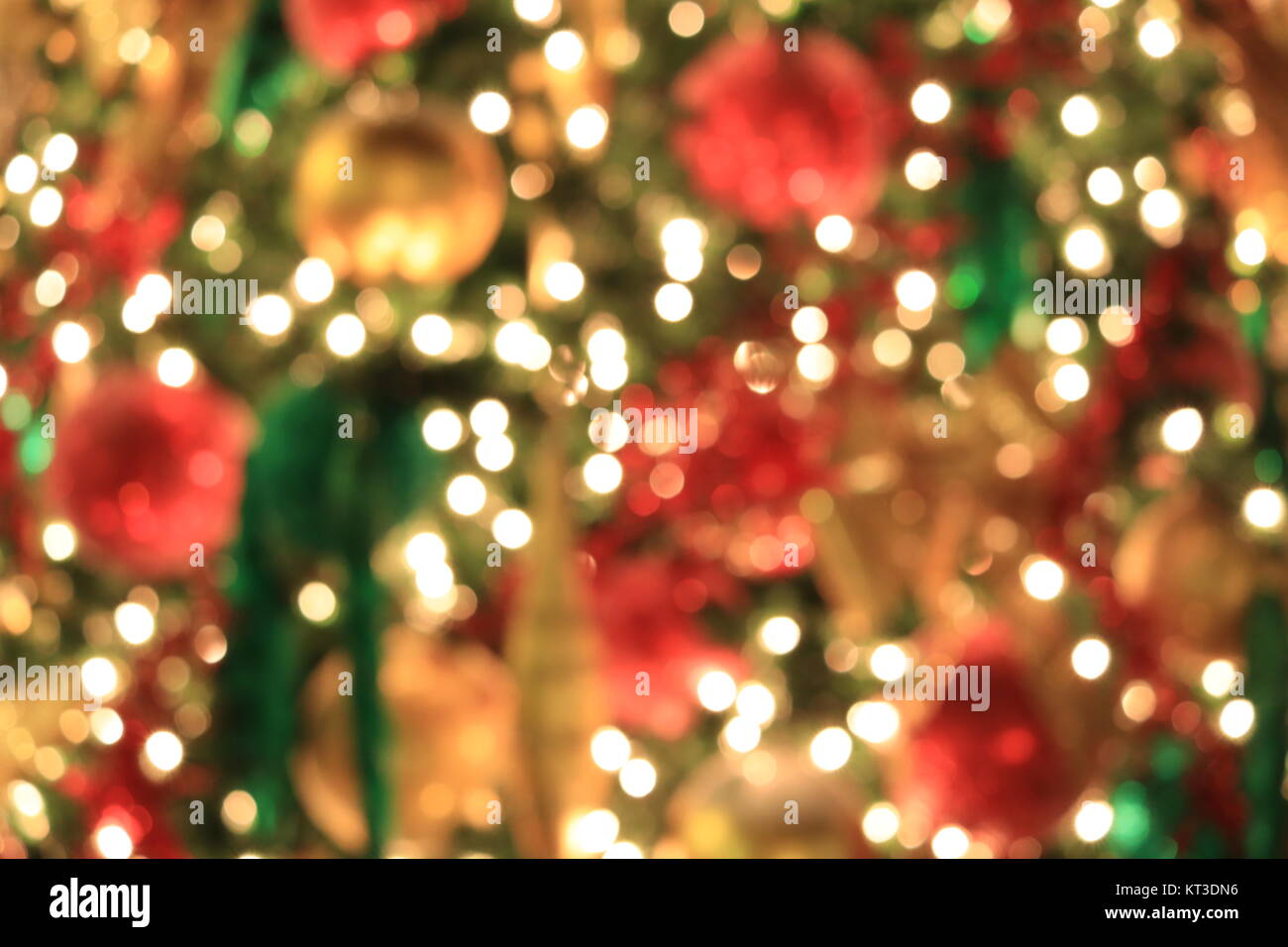 Christmas tree on abstract light golden bokeh background. Stock Photo