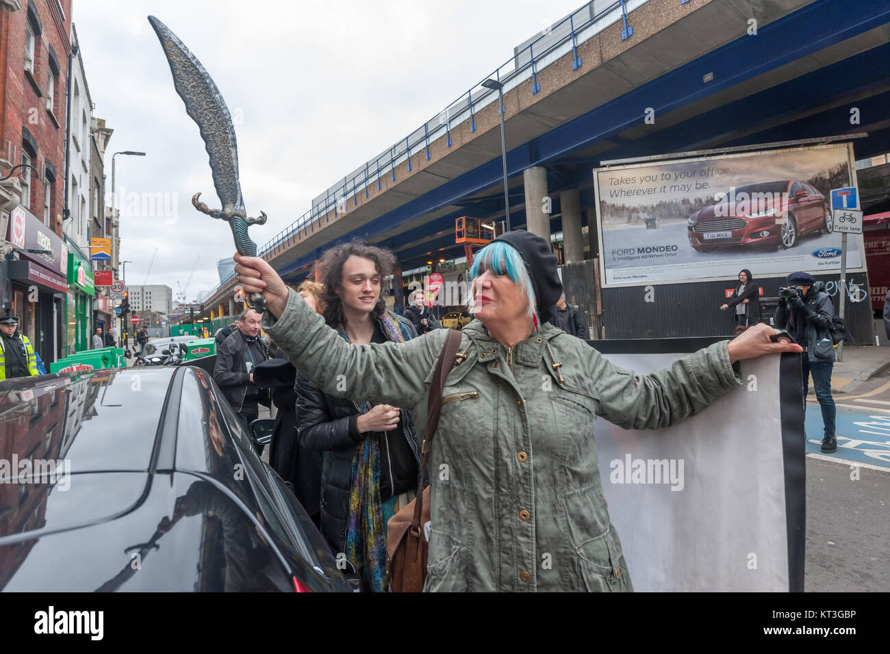 As Class Warr arrive outside the Jack The Ripper 'Museum' Jane Nicholl brandishes the plastic scimitar she had borrowed from her grandson for the event. Stock Photo