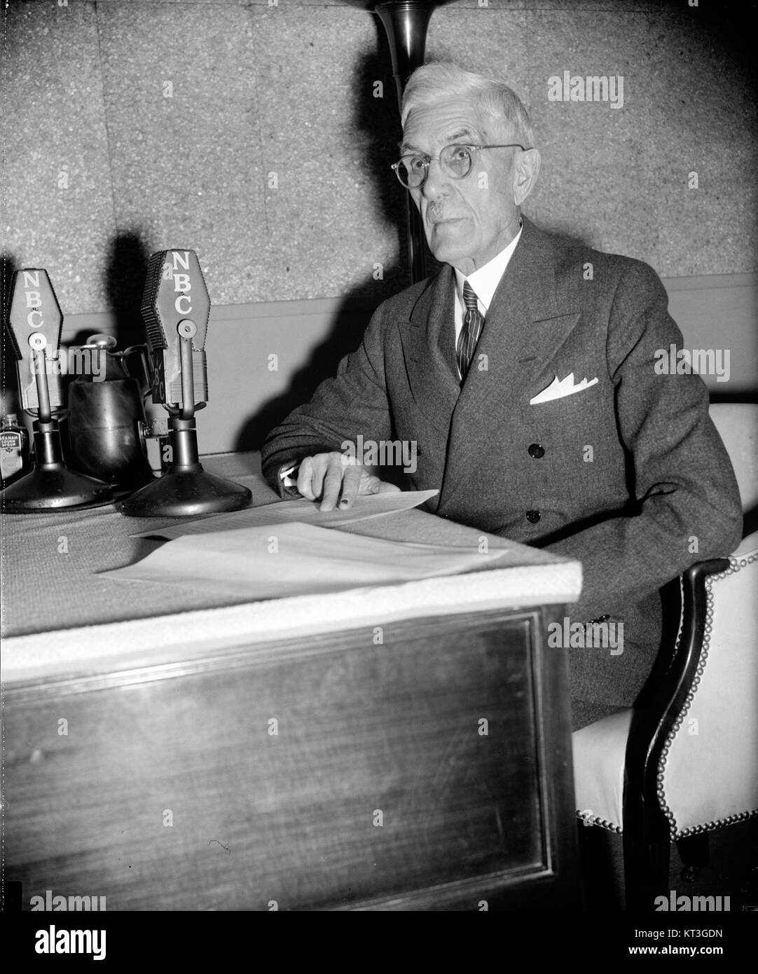 Francis Townsend, seated at desk, with microphones hec.27728 Stock Photo
