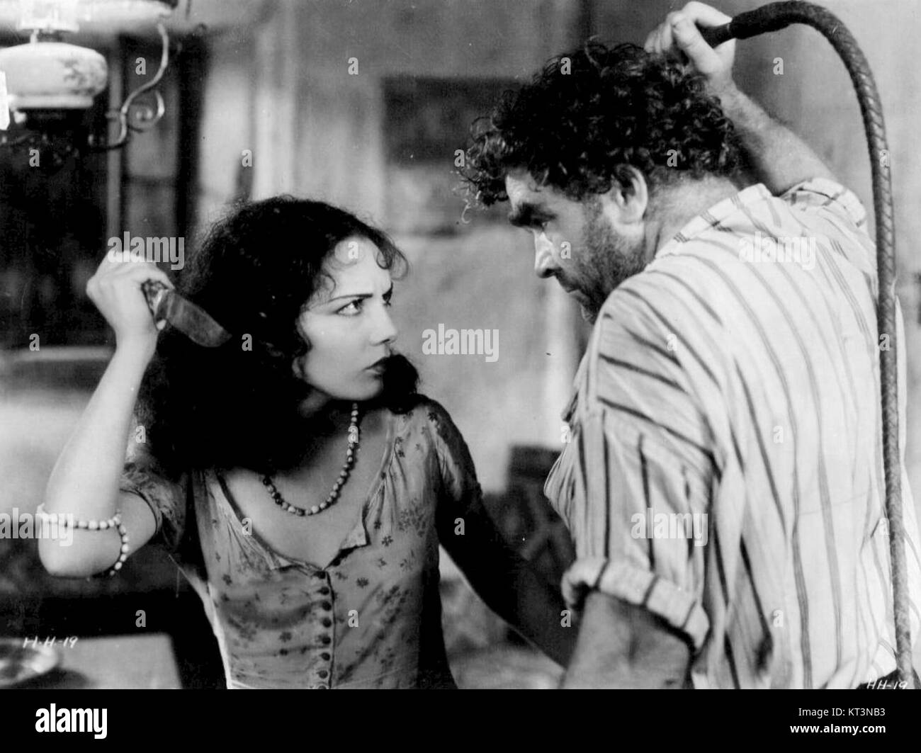 A still from the 1930 film *Hell Harbor*, depicting a dramatic scene from this early Hollywood film. The movie, a silent film, is set in a tropical environment and portrays intense human and natural conflicts. Stock Photo