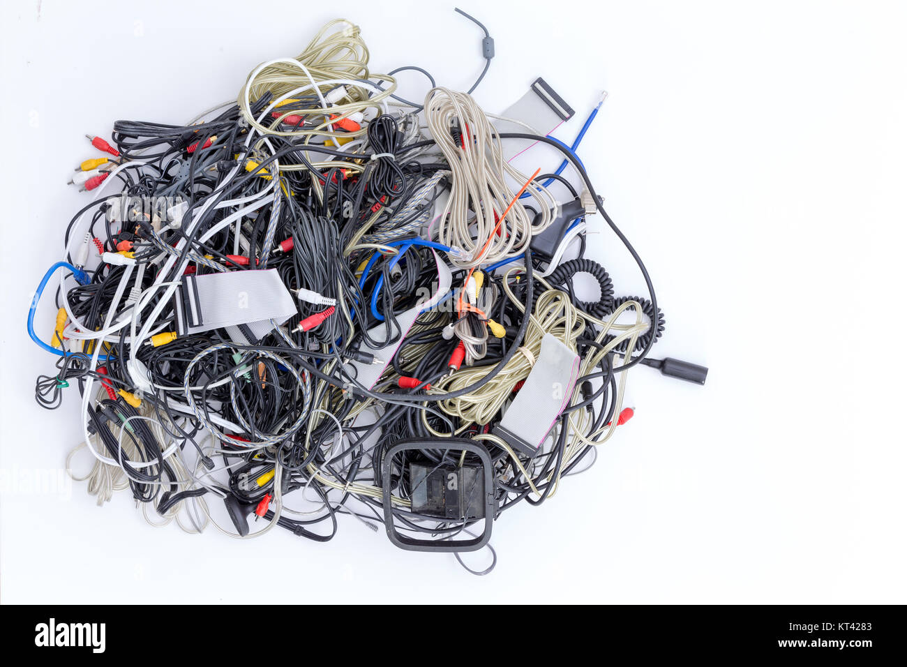 Jumbled pile of old electrical cords and connectors for electronic