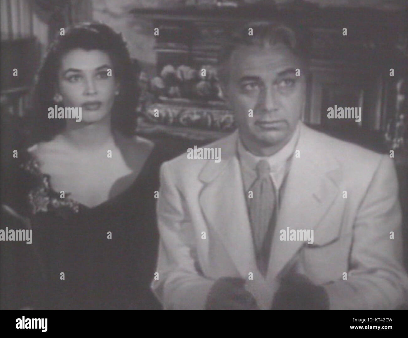 Laurette Luez and Luther Adler appear in the film *DOA*, a crime drama from the 1950s. The image captures them in a key scene, reflecting the film's tense atmosphere and the performances of the actors. Stock Photo