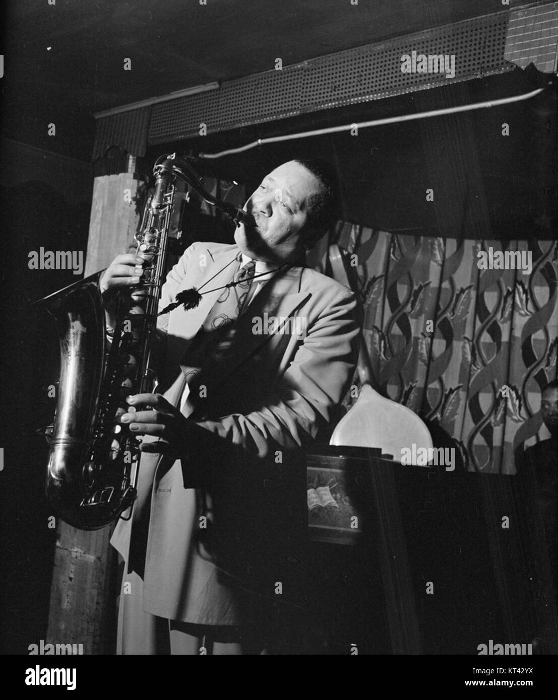 Lester Young, featured in the Gottlieb 09431 photograph, was a renowned American jazz saxophonist. Known for his smooth, distinctive playing style, he became a key figure in jazz during the 1930s and 1940s. Stock Photo