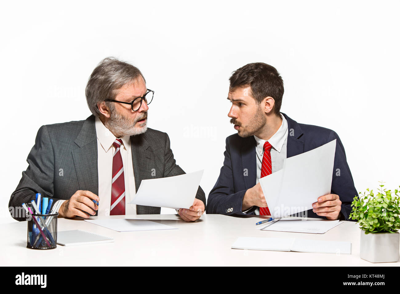 Two Team Members The two colleagues working together at office on white background Stock ...
