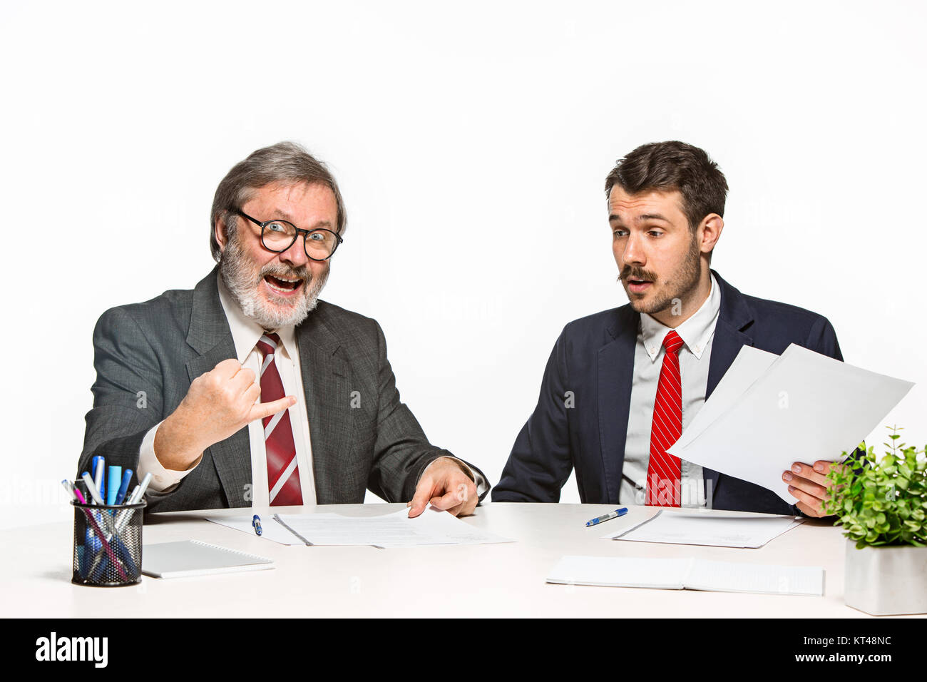 Two Team Members The two colleagues working together at office on white background Stock ...