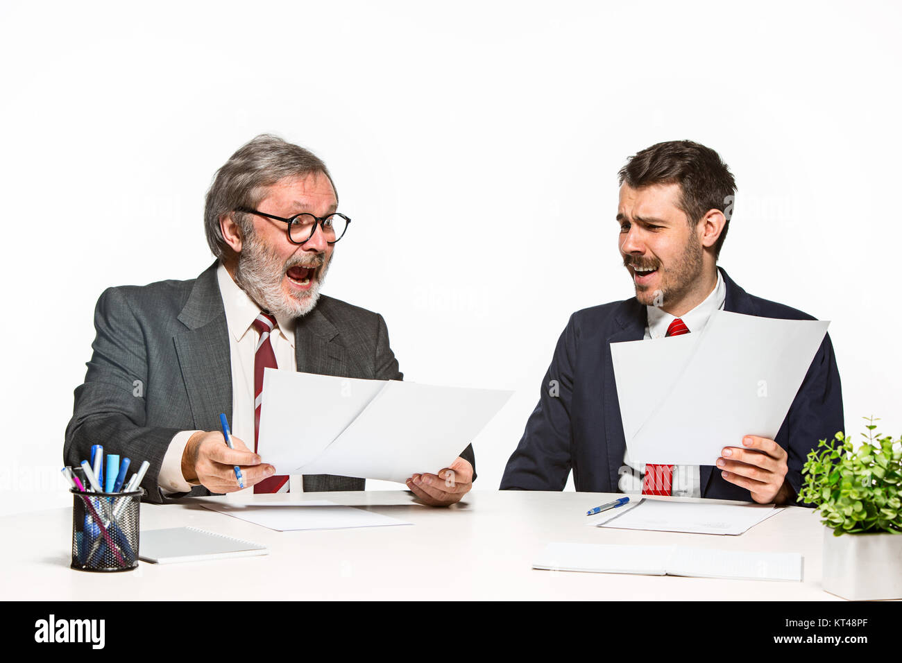 Two Team Members The two colleagues working together at office on white background Stock ...