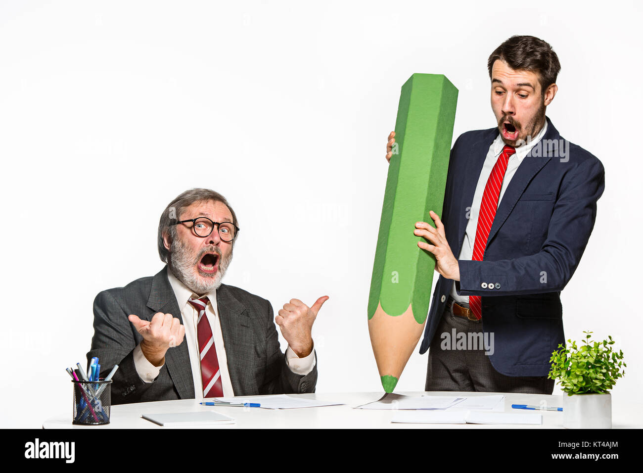 The two colleagues working together at office on white background. Stock Photo