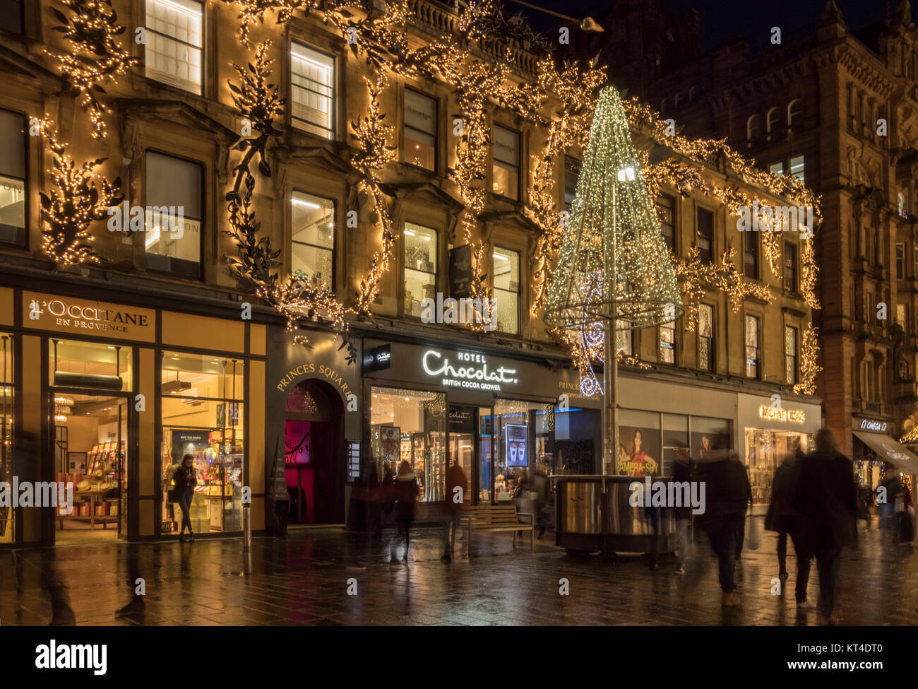 Late night Xmas shopping among festive lights in Buchanan street,  Glasgow,  Scotland, UK. Stock Photo