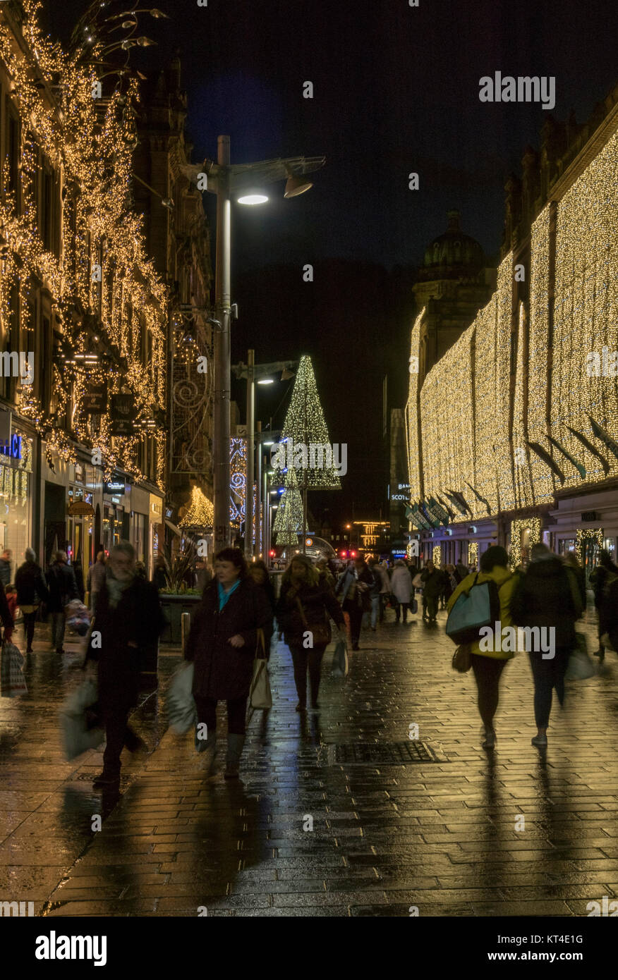 Late night Xmas shopping among festive lights in Buchanan street,  Glasgow,  Scotland, UK. Stock Photo