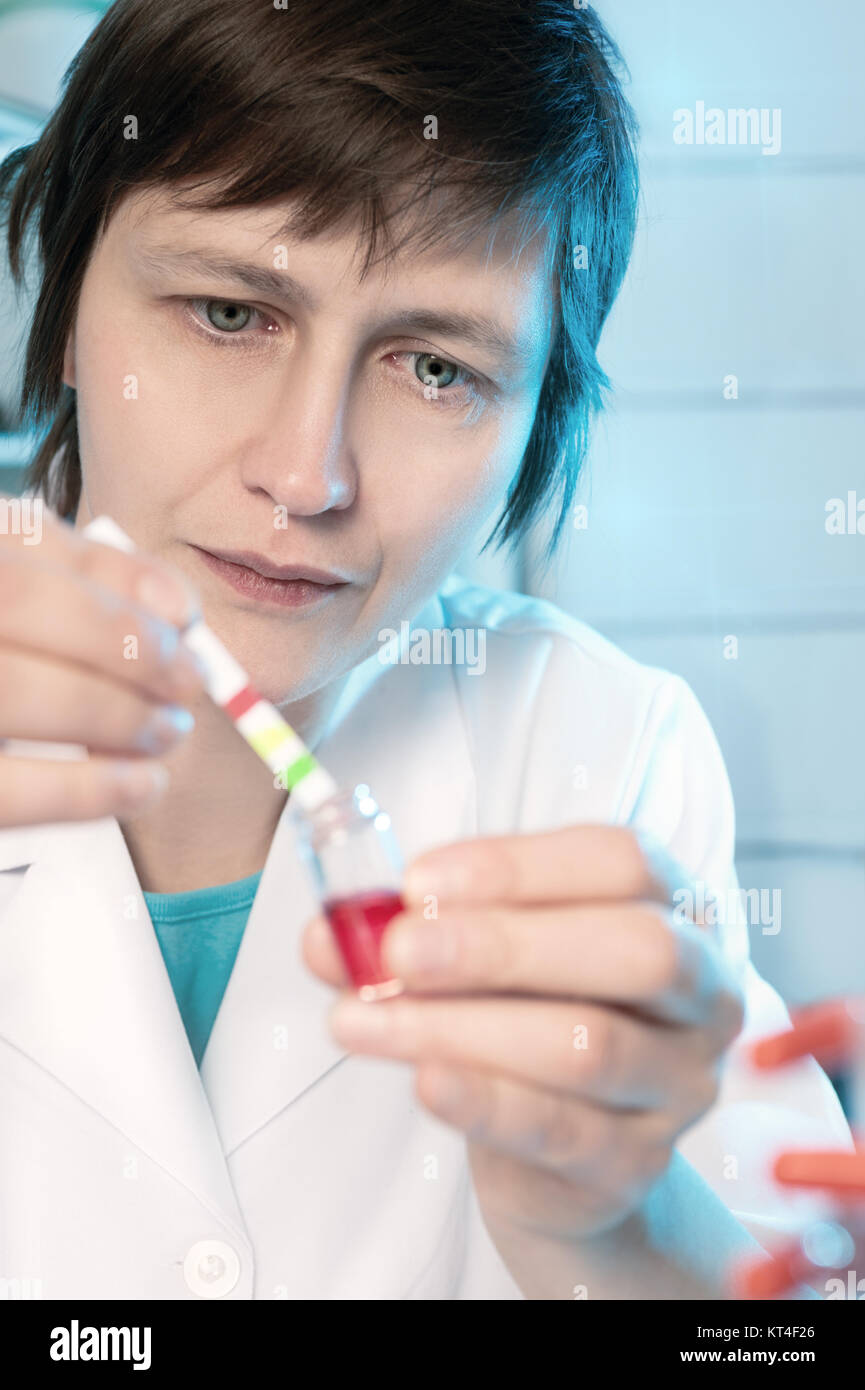 Portrait of a senior scientist or tech measuring pH of a sample Stock Photo