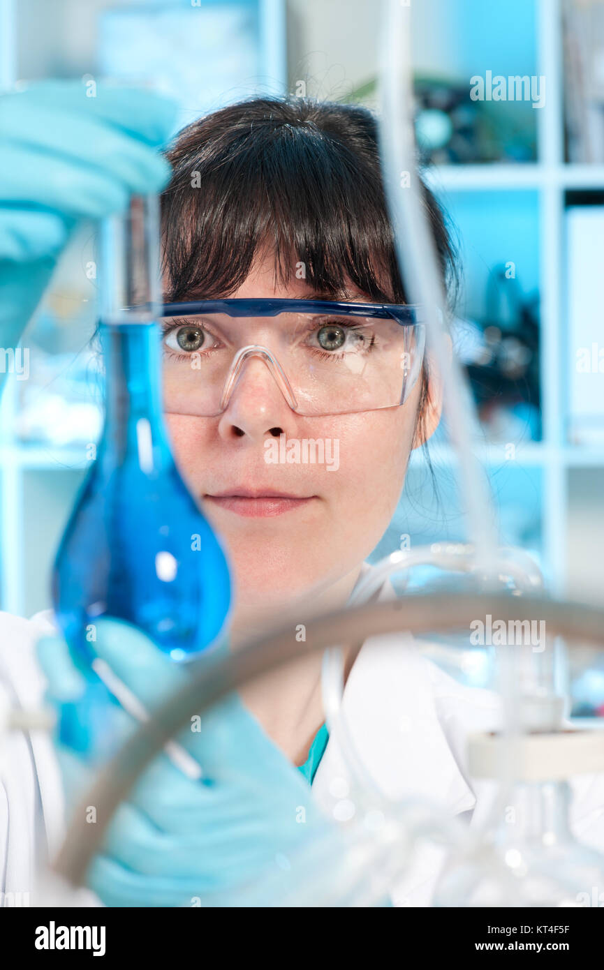 Chemical lab flask woman pharma hi-res stock photography and images - Alamy